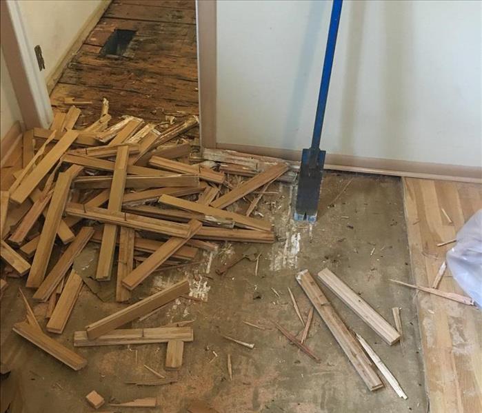 Pile of flooring during demo.