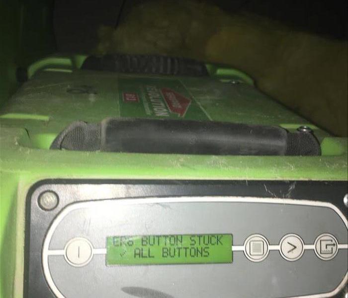Green air mover in a room.