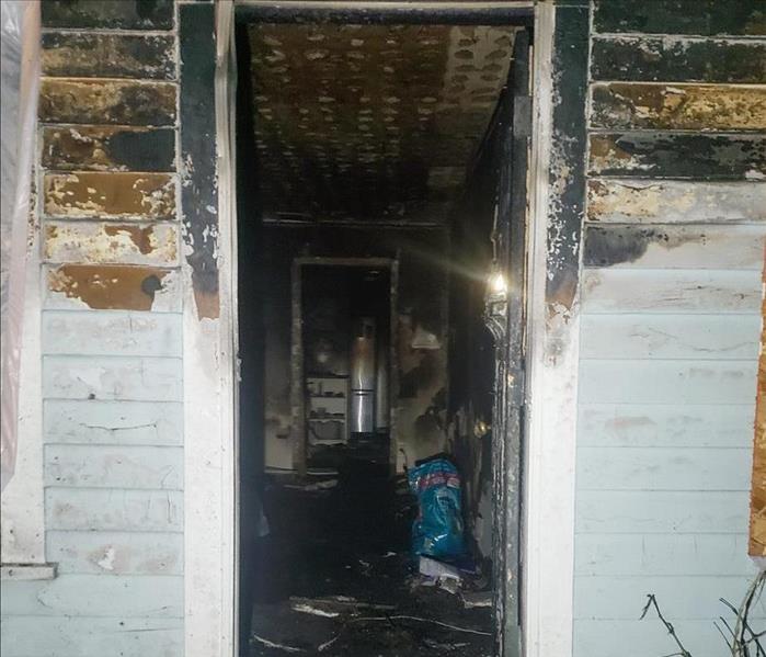 Fire damaged exterior and interior of home.