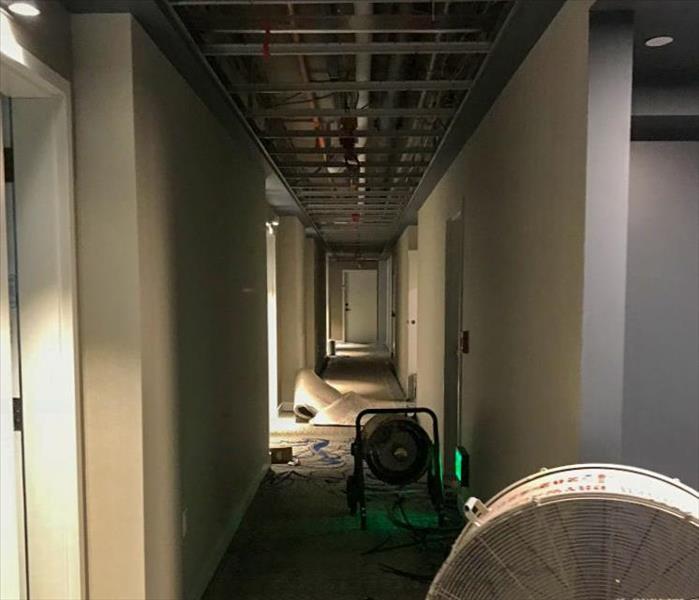 Fan and air mover set up in the hallway of a Shoreline, WA business